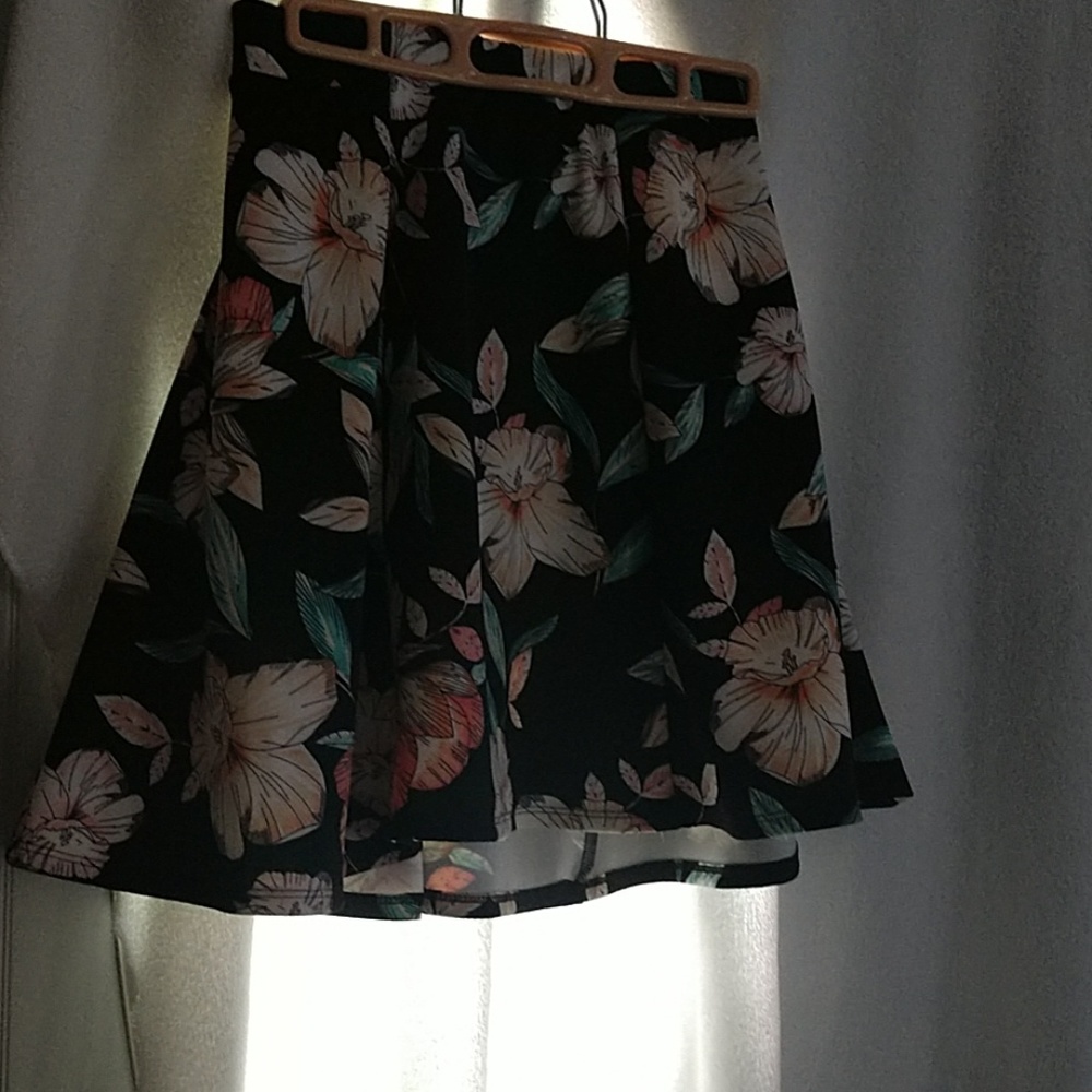 Black mini skirt with flowers.
